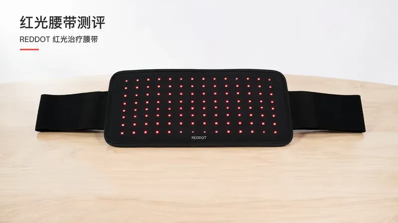 红光治疗腰带平铺在桌面,旁边放着辐照度计和光谱分析仪 — red light therapy belt reviews